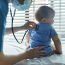 Baby with physician