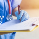 physician with clipboard