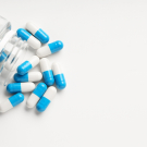 Pills spilling out of bottle
