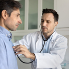 doctor listening to heart