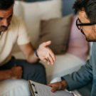 man talking to physician