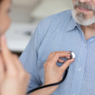 doctor listening to heart rhythm with stethoscope