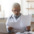 doctor looking through papers