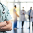 Doctor with arms crossed in hospital